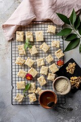 Vertical shot of cracker serving with nuts and chocolate on the side