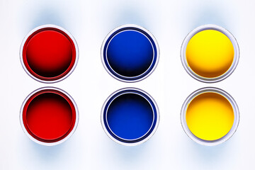 colorful open paint cans red blue yellow isolated on white background