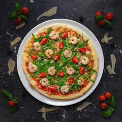 Traditional Italian Pizza with Homemade Tomato Sauce, Roasted Shrimp, Cherry Tomato And Arugula, Top Down Shoot, Appetizing Background 