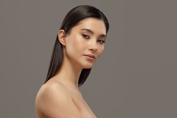 Attractive female asian model with healthy skin portrait.