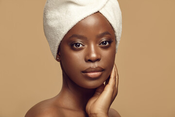 Attractive woman with brown chocolate healthy skin.