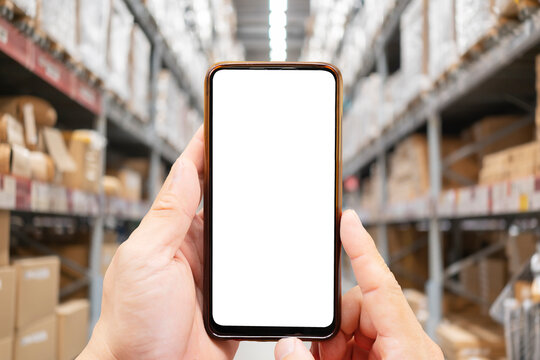 Online shopping concepts with youngman using smartphone with product package box.