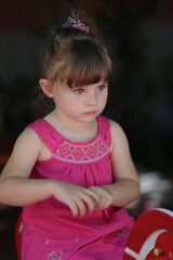 portrait of a little child in a pink dress in sofia 