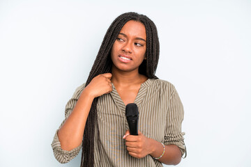 black pretty woman feeling stressed, anxious, tired and frustrated. singer with a microphone