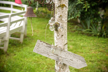 Soft focus vintage wedding sign. Handmade wooden board with the inscription Wedding
