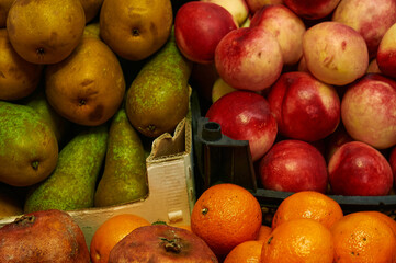 Fruit stall at the farmers market. Bright ripe fruits of plants are laid out for sale. Small business retail concept. Selective focus