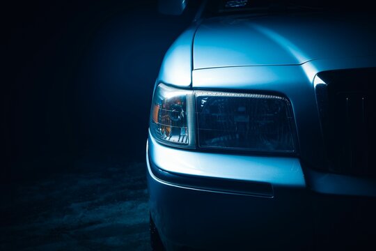 Headlamp Of Mercury Grand Marquis With A Blue Light At Night