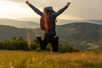 Man traveling with backpack hiking in mountains Travel Lifestyle success concept adventure active...