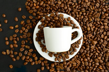 Coffee cup with roasted coffee beans, top view, flat lay. Coffee background