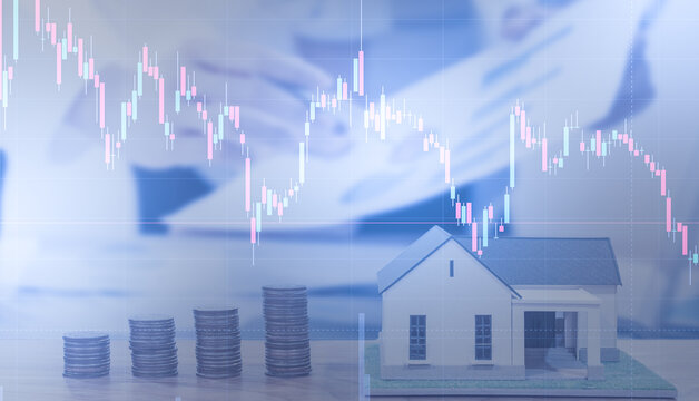 Real estate investment concept House money loan mortgage financial.Hand work business Stock market graph