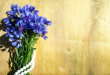 Naklejka na ściany i meble bouquet of flowers on a wooden background