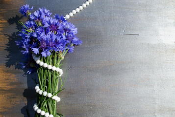 bunch of flowers on wooden background