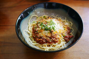 plate of cream and herb pasta on table 