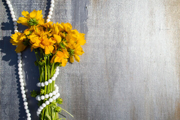 bouquet of yellow flowers on wooden background