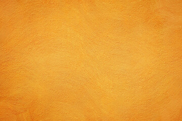 Orange yellow background with plaster texture and paintbrush pattern.