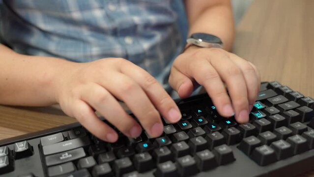 Hands typing on the keyboard with illustrated letters