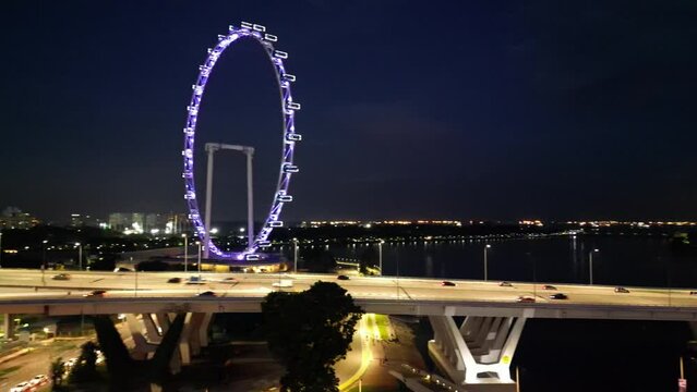 Rotating view of Singapore CDB area with colorful business buildings at night