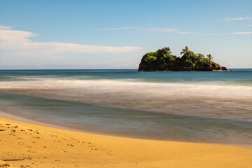 Mesmerizing view from the beach to the deserted island in daylight in Playa Manzanillo, Costa Rica.
