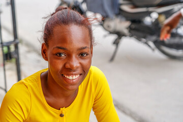 Happy smiling Dominican girl looking at the camera.