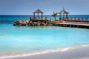 Obraz na płótnie Canvas Tropical paradise: caribbean beach with pier and gazebo, Montego Bay, Jamaica