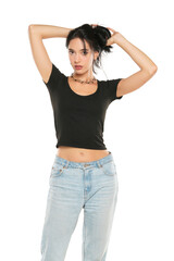 Fototapeta premium Young beautiful woman in loose jeans posing on white background