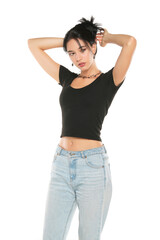 Young beautiful woman in loose jeans posing on white background