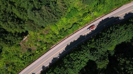 Aerial view of cars on Pacific Rim Highway in Vancouver Island, BC, Canada
