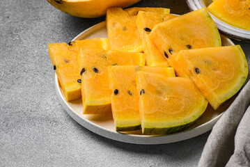 yellow watermelon on a gray background