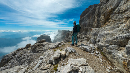 woman climbing the via ferrata 