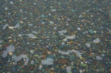 Pebble beach flooded with water after high tide
