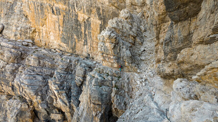 climbing the via ferrata "via delle bocchette" mountain sign in the brenta Dolomites in Italy