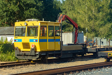 The service rail vehicle with crane on a railways station