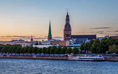 Famous panorama with Riga St. Peter 's Church and Riga Cathedral with linden trees Alley