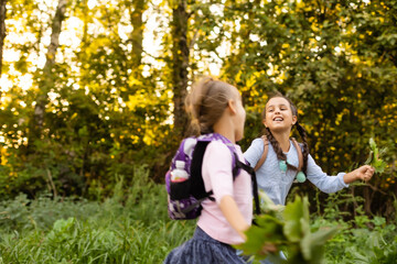 Naklejka na ściany i meble schoolgirls among the autumn landscape.