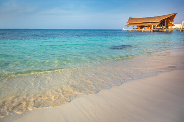 Tropical paradise: Cancun beach with rustic palapa pier, Riviera Maya