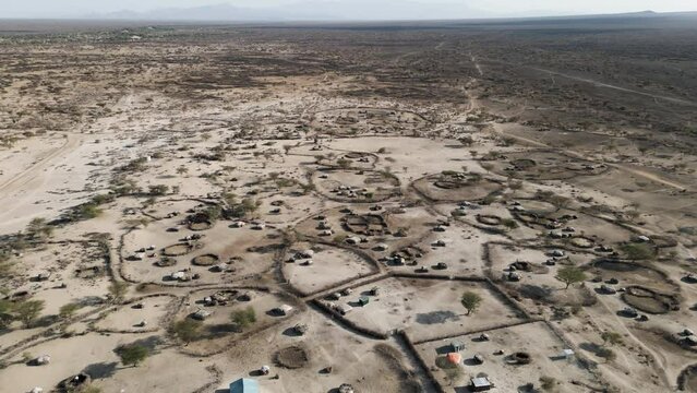 Climate change.drought.water crisis.poverty.Aerial fly over view.Impoverished African villages in a drought stricken area. Kenya