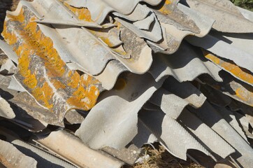 Broken Asbestos Cement Sheets with Asbestos Waste fly tipping Group of broken and fibrous slice