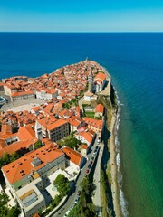 Low-angle view of modern buildings near the sea in Piran, Slovenia