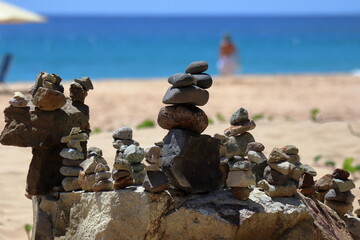 Rock cairn at trail to Bode beach at Fernando de Noronha island, Brazil.