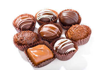 An assortment of eight candies, ready to eat.