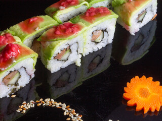 sushi on a black plate