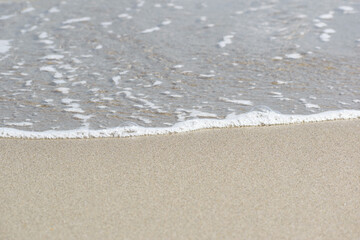 Sunny Beach Shoreline where the Ocean Meets the Light Sand