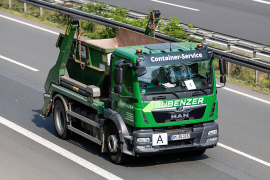 WIEHL, GERMANY - MAY 3, 2022: Bubenzer MAN TGM roll-off conatiner truck on motorway