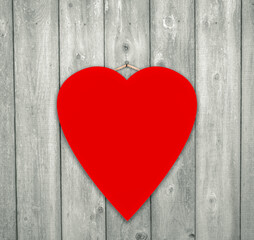 red valentine heart on wood background
