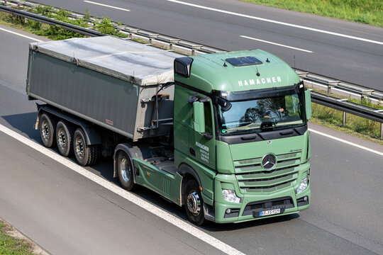WIEHL, GERMANY - MAY 3, 2022: Hamacher Mercedes-Benz Actros truck with tipper trailer on motorway
