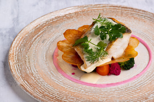 Closeup Of Pike Perch With Vegetables On Plate