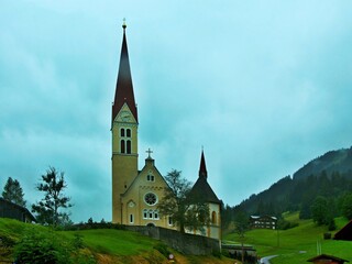 Fototapeta na wymiar Austrian Alps - view of the church in the town of Holzgau in the Lechtal Alps