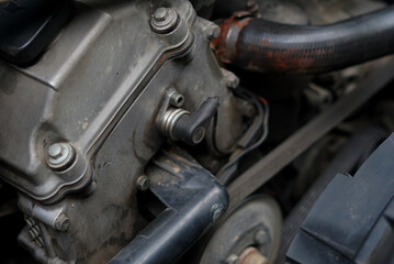 dirty engine parts on 90s cars taken close up