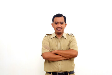 Fototapeta premium Indonesian government employees standing while smiling and looking at the camera. Isolated on white