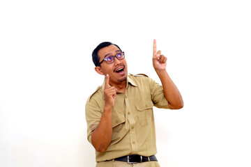 Amazed Indonesian government employees standing while pointing above. Isolated on white background
